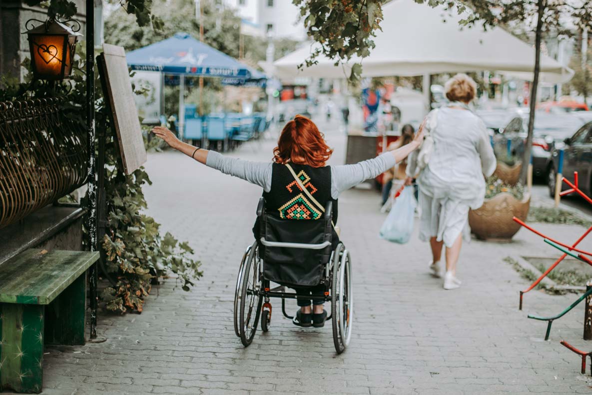 happy young woman in a wheelchair rides around the 2022 11 17 00 05 11 utc 1