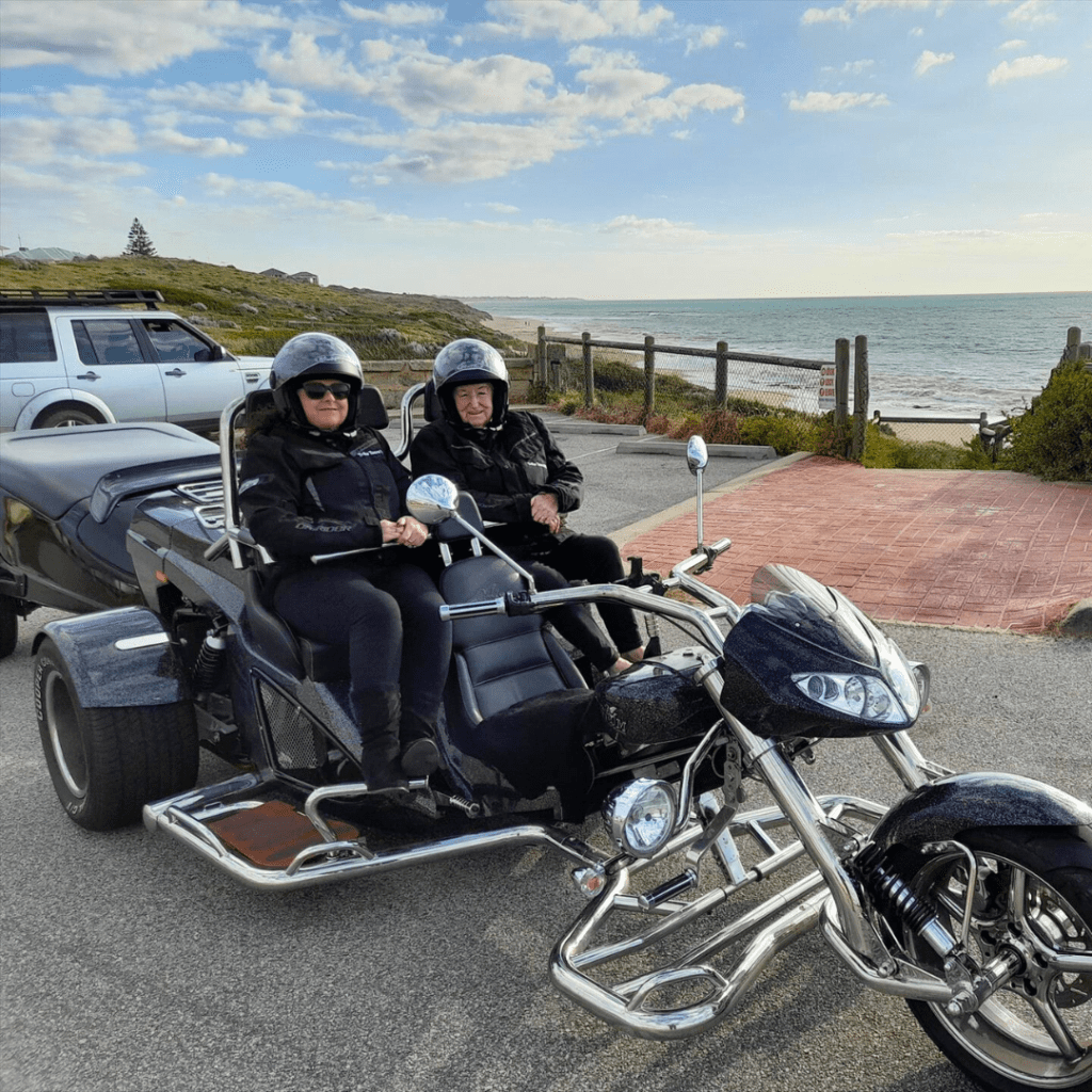 two people on a motorcycle with a sidecar