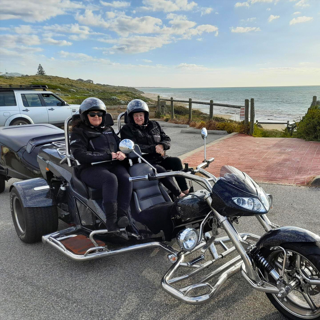 two people on a motorcycle with a sidecar