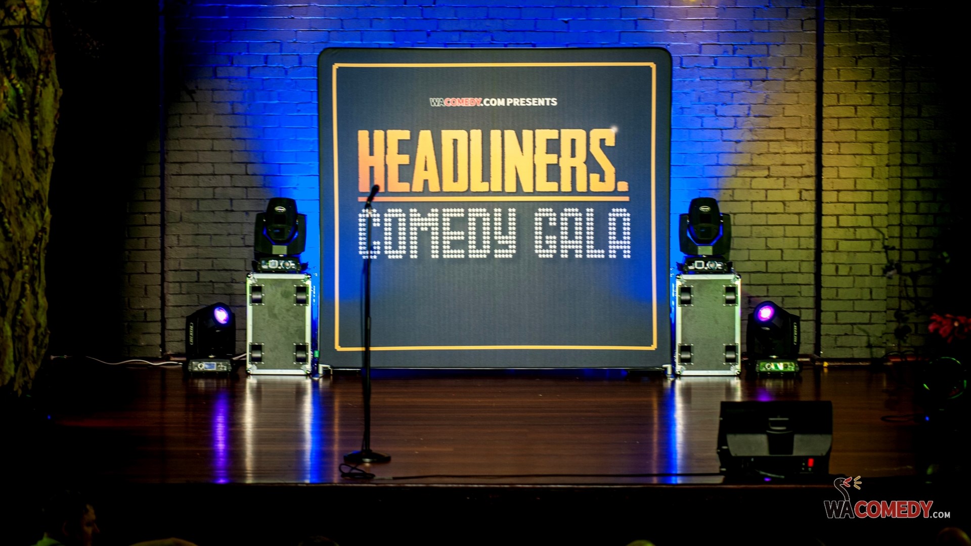 a stage with the banner 'Headliners Comedy Gala"