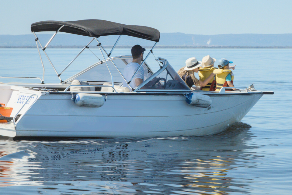 a family group on a boat in the water