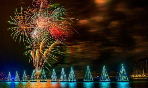 fireworks are lit up in the sky over the Mandurah Estuary