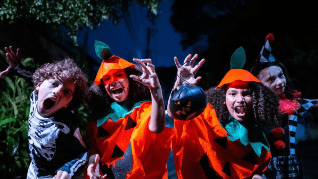 a group of children dressed up in halloween costumes